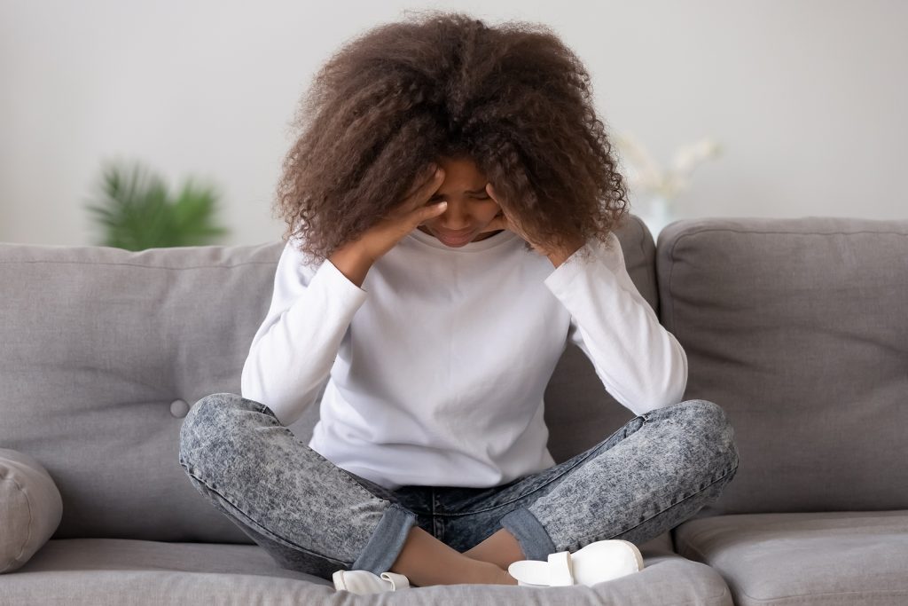 Depressed Upset African American Teen Girl Feeling Hurt Sitting